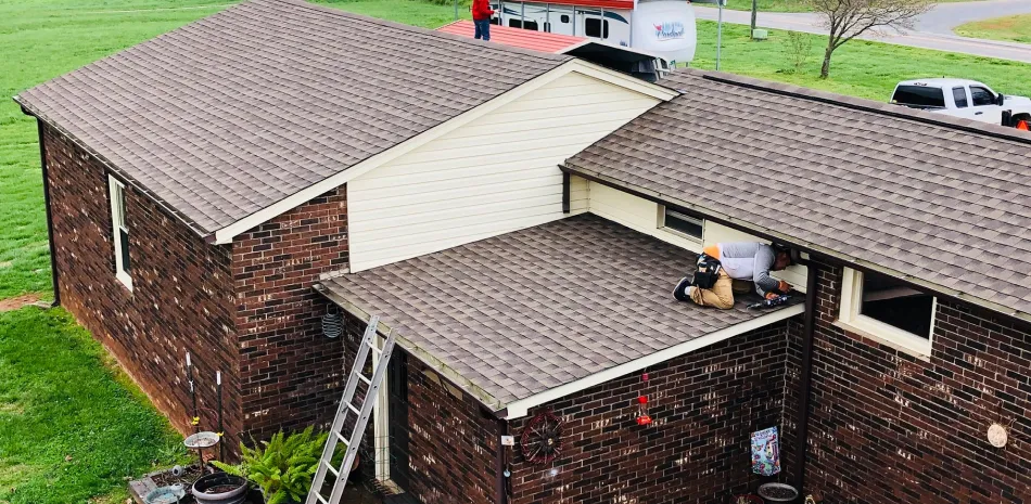 Man working on shingle roof in Mooresville, NC